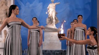 Under a cloud, the Olympic flame begins its journey to the Milan Cortina Winter Olympics