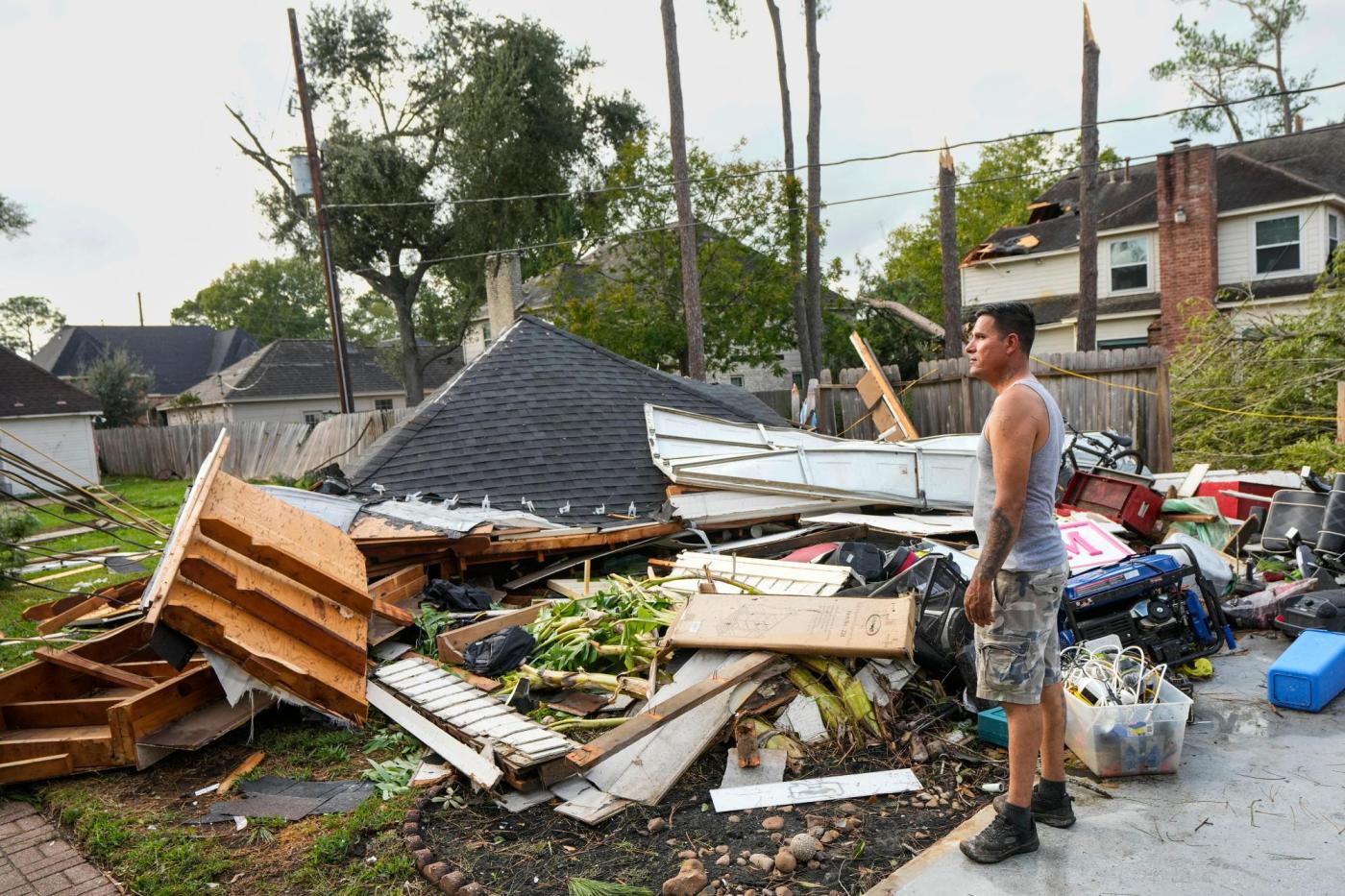 Torn roofs and smashed windows among damage to over 100 homes in a tornado near Houston