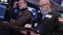 Wall Street holds steadier, for now, ahead of a crucial couple of tests