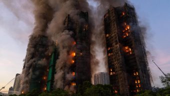 At least 13 dead after fire engulfs Hong Kong high-rise residential buildings