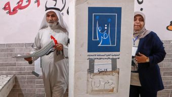 Iraqis vote in a parliamentary election marked by tight security and a major political boycott