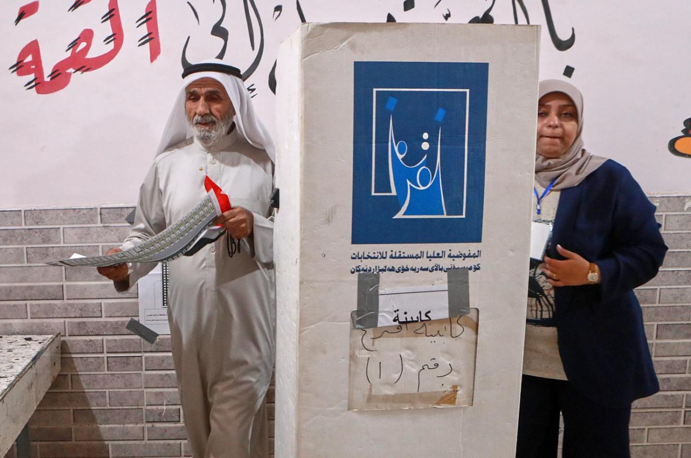 Iraqis vote in a parliamentary election marked by tight security and a major political boycott