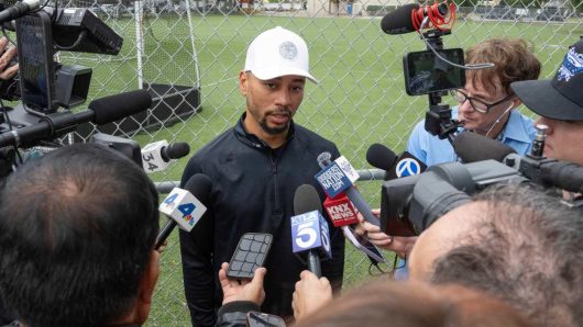 Mookie Betts, his wife Brianna, and family joined volunteers giving turkeys to 750 families