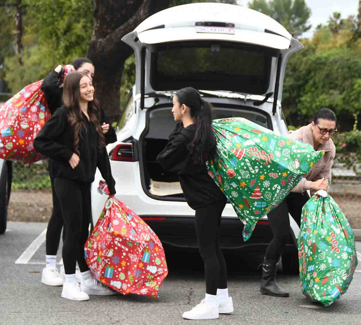 Hundreds of toys were brought to Encino Little League park for children in need