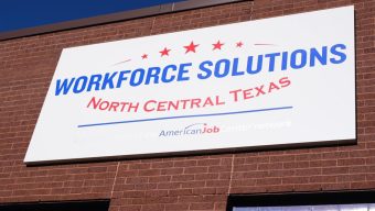 Fewer Americans sought unemployment benefits last week as layoffs remain low