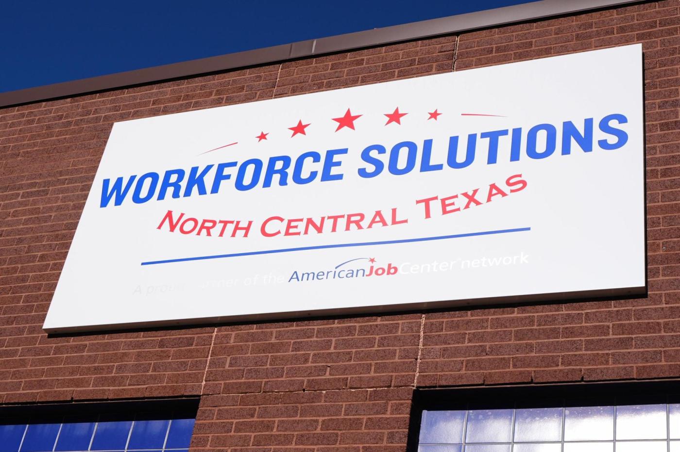 Fewer Americans sought unemployment benefits last week as layoffs remain low