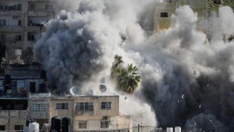 Israeli forensics experts examine remains handed over by fighters in Gaza