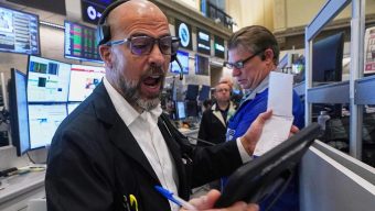 Crypto stocks help pull Wall Street lower and threaten its 5-day winning streak