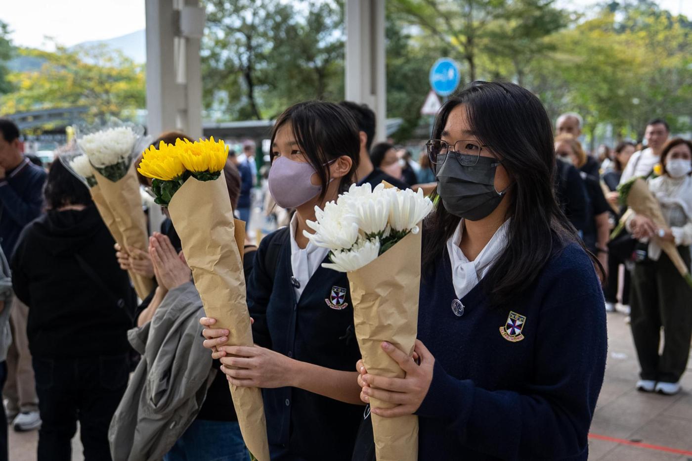 Hong Kong fire probe reveals unsafe netting as public mourns and government stifles dissent