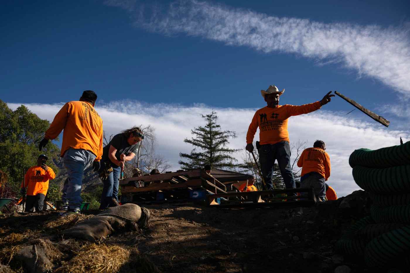 In Altadena, immigrant workers, volunteers clean up soil for future community garden