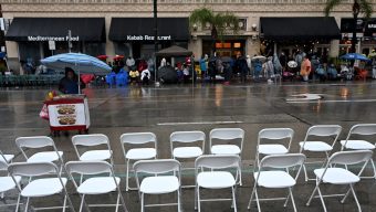 Rain-soaked Rose Parade sees drop in attendance